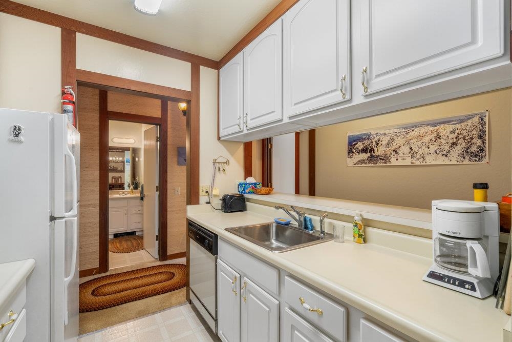 440 Shirley Cyn Road, Unit 50 Olympic Valley, CA 96146 - Photo 15 of 28 a kitchen with a sink and cabinets
