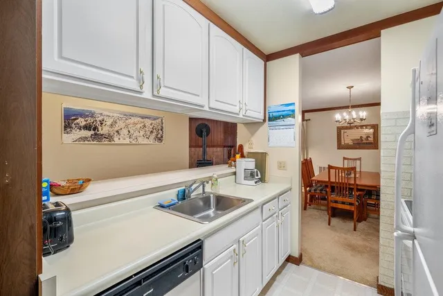 a kitchen with a sink cabinets and utility