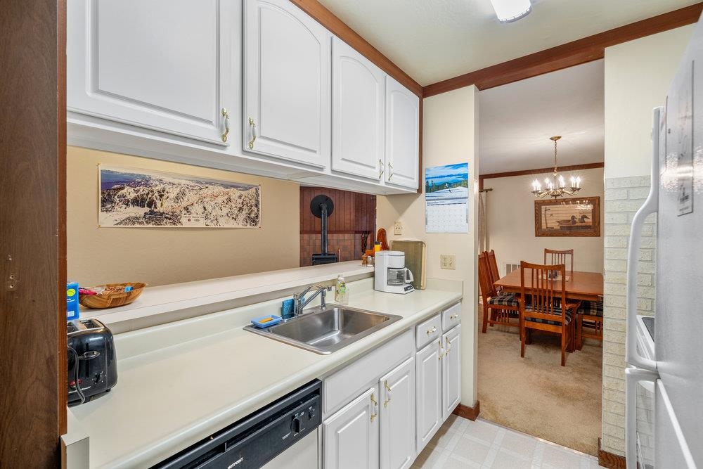 440 Shirley Cyn Road, Unit 50 Olympic Valley, CA 96146 - Photo 16 of 28 a kitchen with a sink cabinets and utility