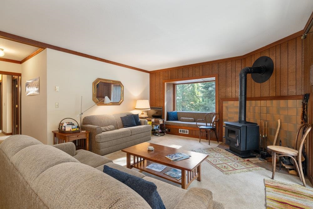 440 Shirley Cyn Road, Unit 50 Olympic Valley, CA 96146 - Photo 17 of 28 a living room with furniture a large window and a flat screen tv