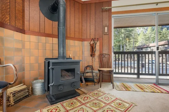 a living room with furniture a rug and a fireplace