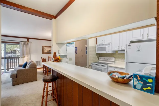 a view of an entryway with a door and wooden floor