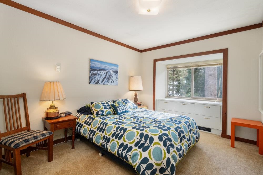440 Shirley Cyn Road, Unit 50 Olympic Valley, CA 96146 - Photo 7 of 28 a bedroom with a bed and a window