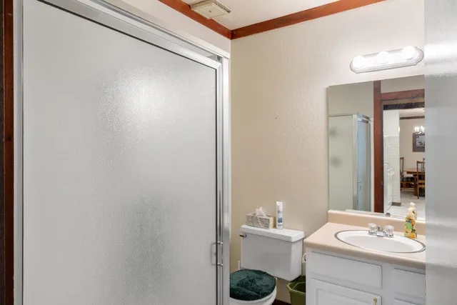 a bathroom with a sink toilet and vanity