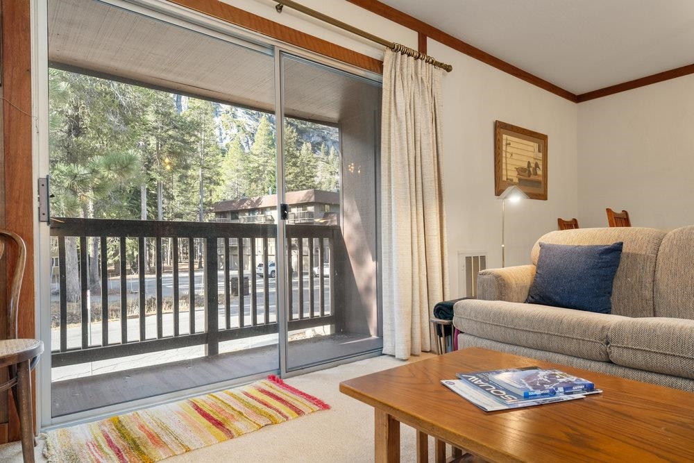 440 Shirley Cyn Road, Unit 50 Olympic Valley, CA 96146 - Photo 9 of 28 a living room with furniture and a window