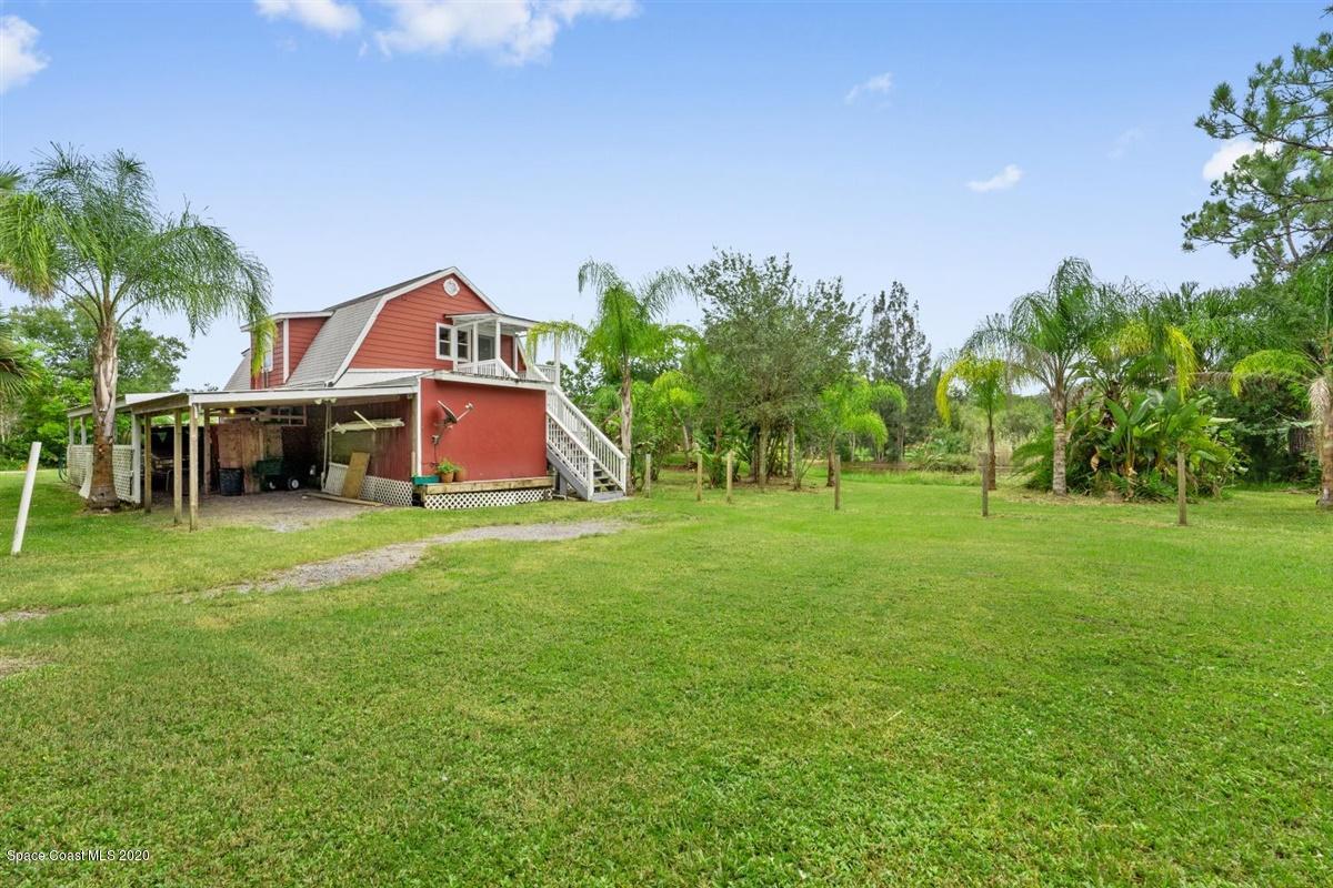 3600 Leghorn Road Grant Valkaria, FL 32950 - Photo 27 of 33 a front view of a house with garden