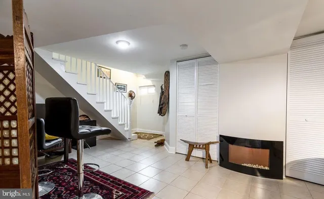 a view of entryway with wooden floor and furniture