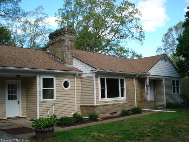 28 Eager Road Franklin, CT 06254 - Photo 1 of 1 a view of a house with a yard potted plants and a large tree