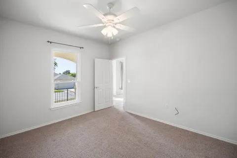 a bathroom with a sink toilet vanity and shower