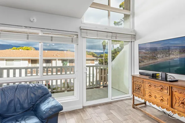 a living room with furniture a dining table and a stove top oven