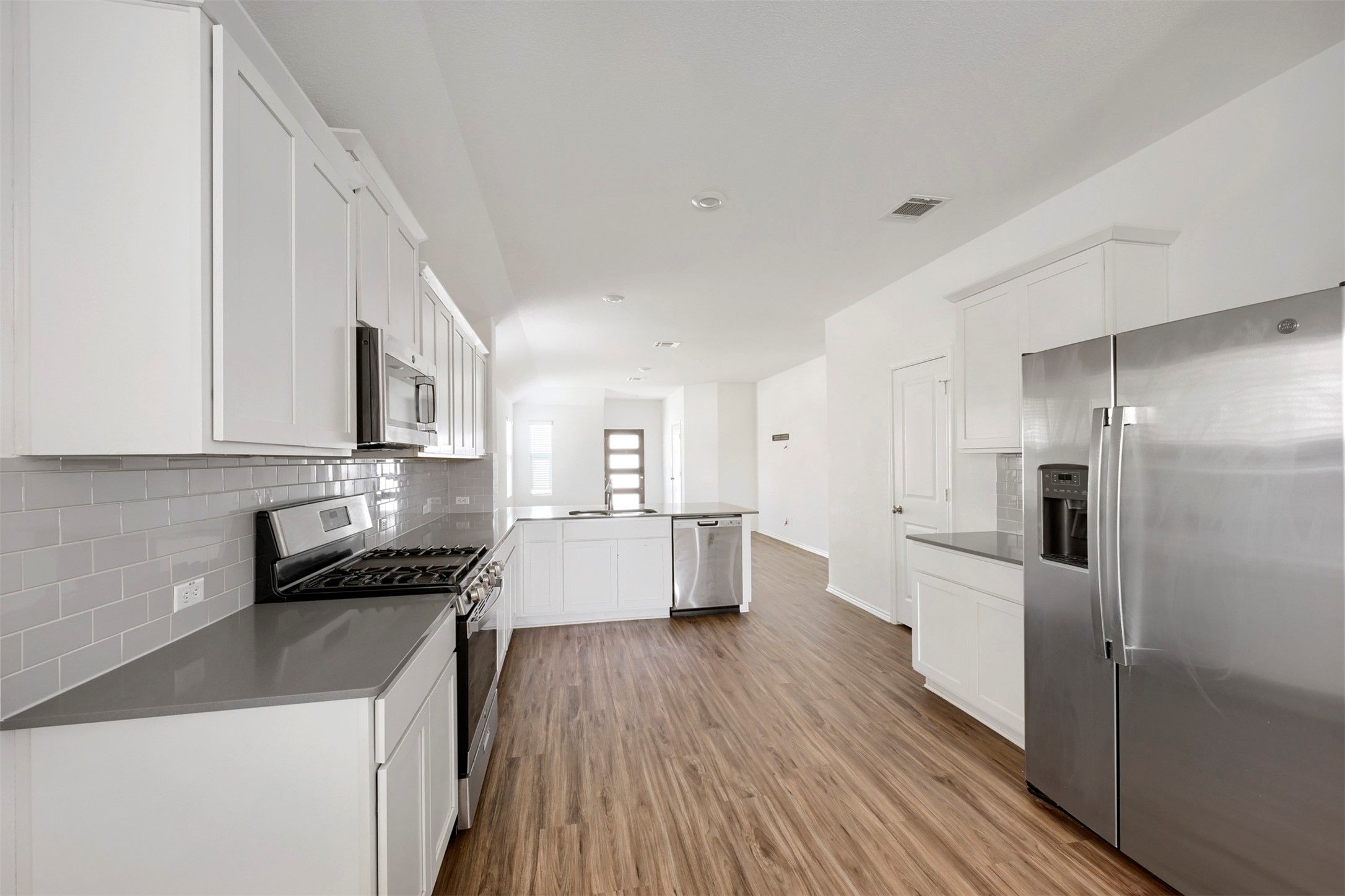 120 Milliner Loop Hutto, TX 78634 - Photo 6 of 15 A well-appointed kitchen showcasing contemporary finishes and stainless steel appliances.