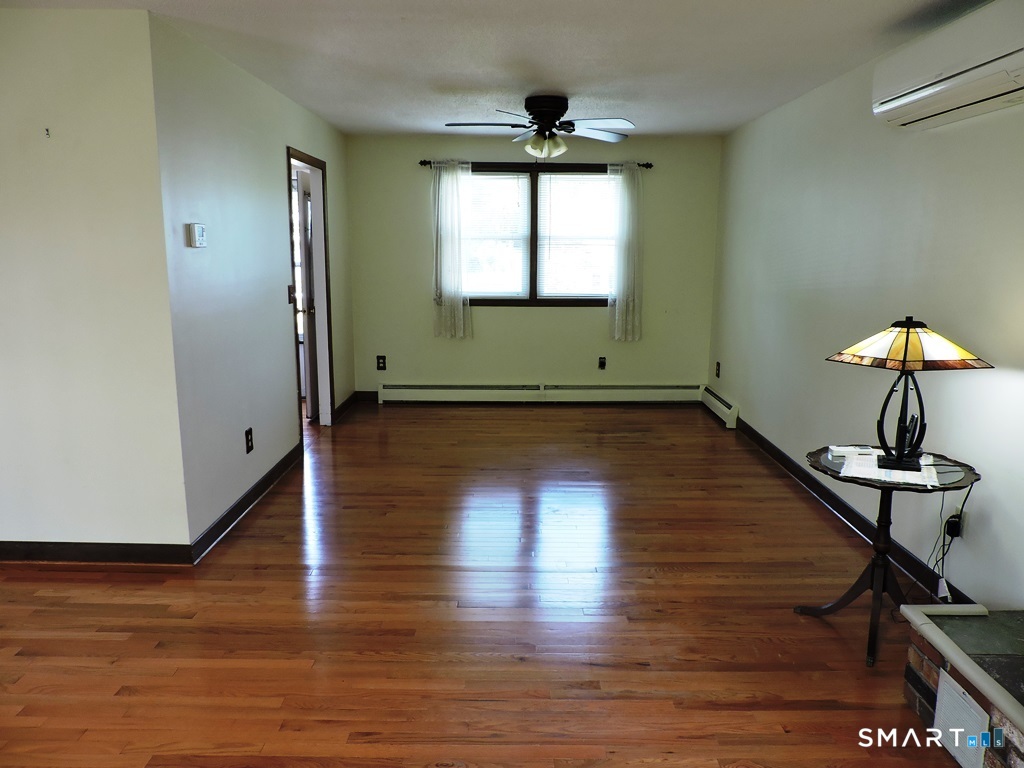 269 Griffin Road South Windsor, CT 06074 - Photo 8 of 36 wooden floor in an empty room with a window