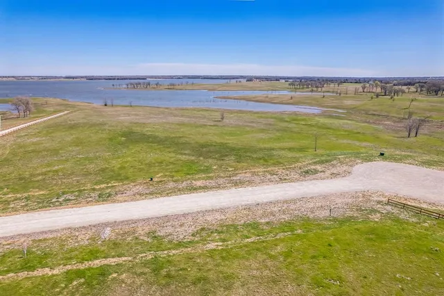 a view of a ocean with a building in the background