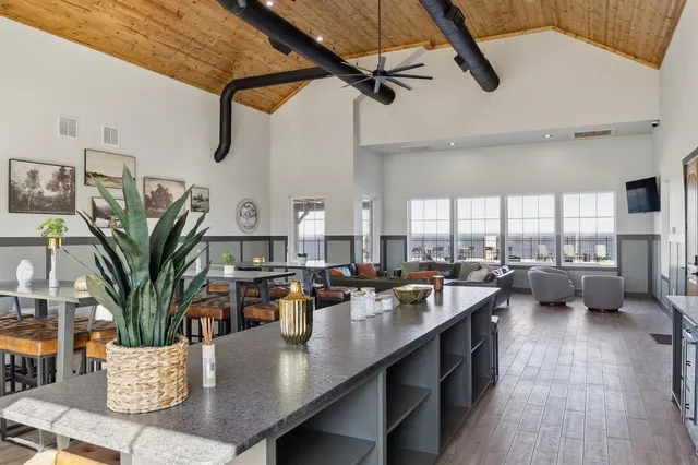 a view of a swimming pool with furniture