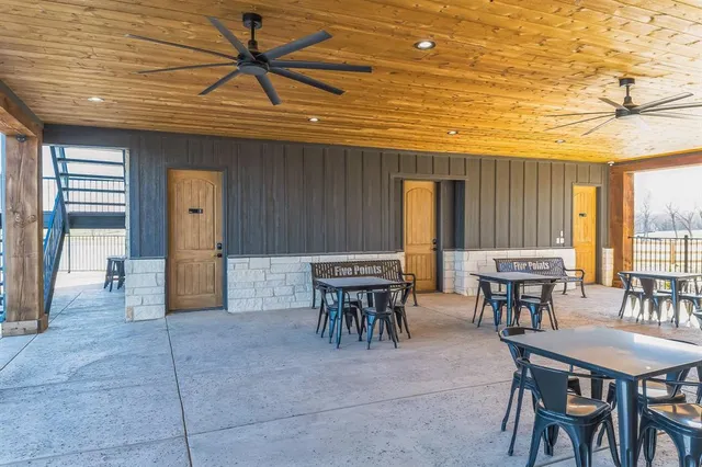 a living room with lots of furniture and a table