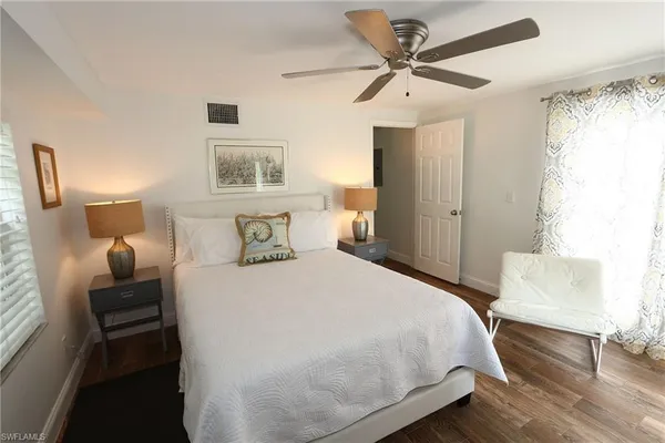 a bedroom with bed and window