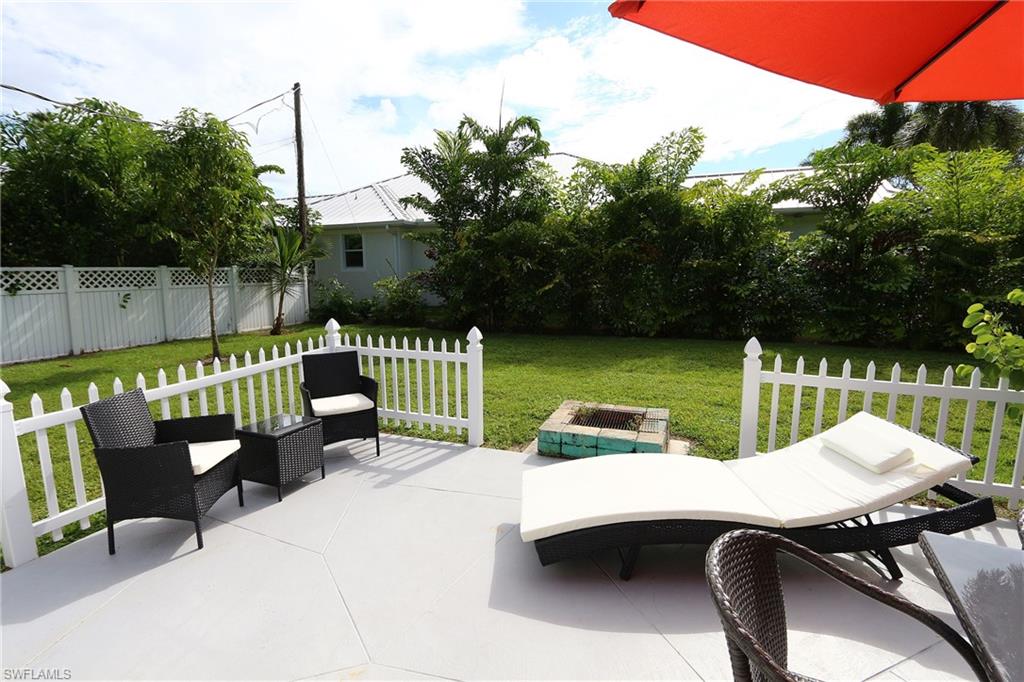 714 11th Street North Naples, FL 34102 - Photo 25 of 27 a view of a chairs and table in the patio