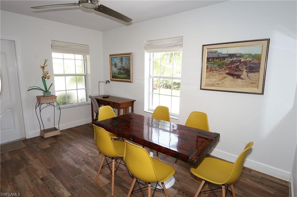 714 11th Street North Naples, FL 34102 - Photo 3 of 27 a living room with furniture and wooden floor