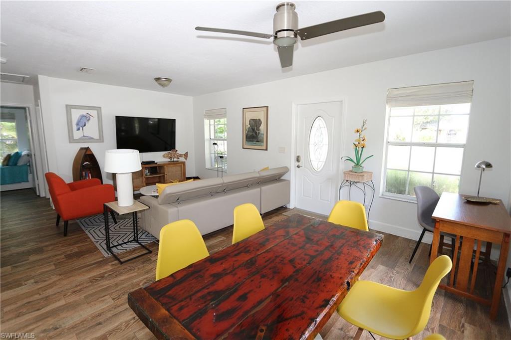 714 11th Street North Naples, FL 34102 - Photo 4 of 27 a living room with furniture and a flat screen tv