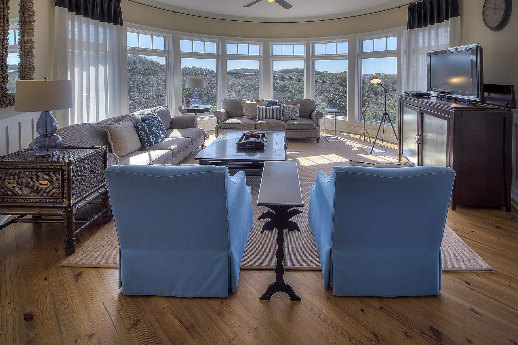 99 Compass Point Way South, Unit 208 Watersound, FL 32461 - Photo 1 of 17 a living room filled with furniture and a flat screen tv