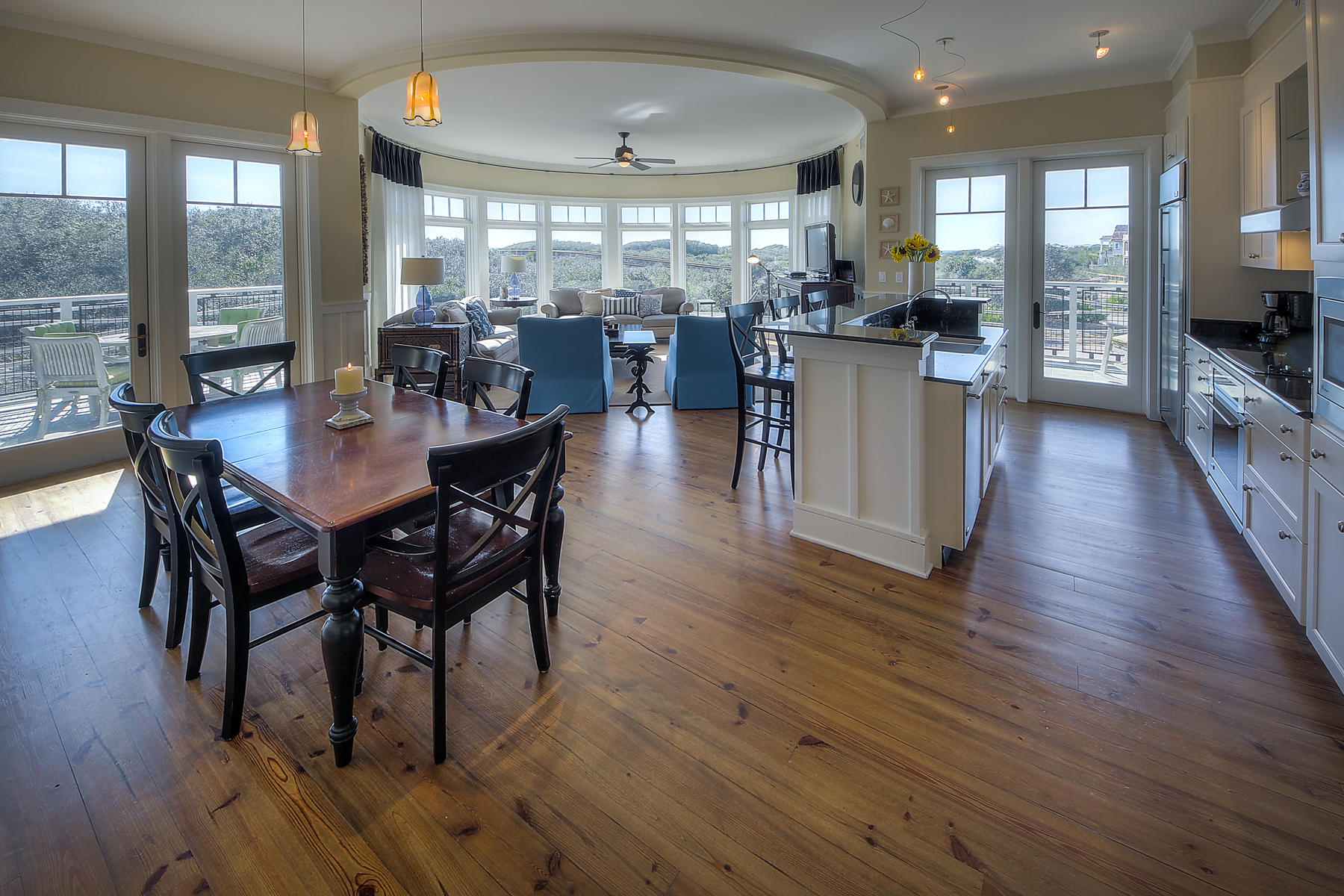 99 Compass Point Way South, Unit 208 Watersound, FL 32461 - Photo 17 of 17 a view of a dining room and livingroom with furniture wooden floor a chandelier