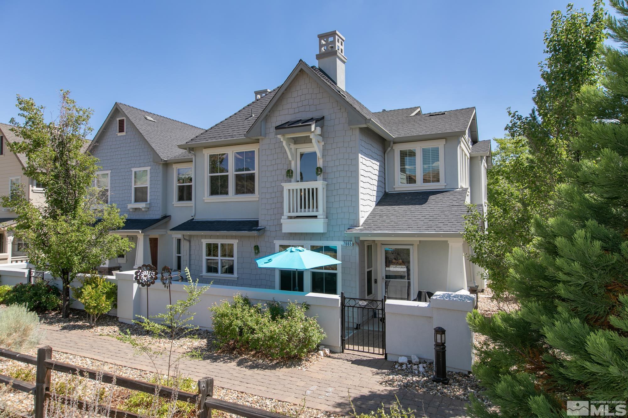 7665 Pebblestone Way Reno, NV 89523 - Photo 1 of 34 a front view of a house with garden