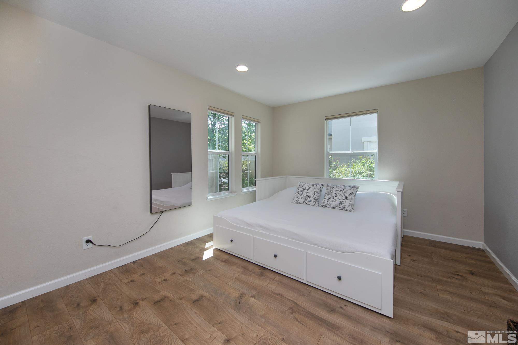 7665 Pebblestone Way Reno, NV 89523 - Photo 15 of 34 a room with a bed and a window