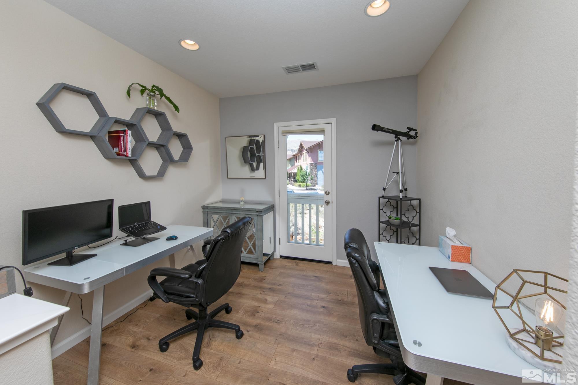 7665 Pebblestone Way Reno, NV 89523 - Photo 17 of 34 a view of a workspace with furniture and a window