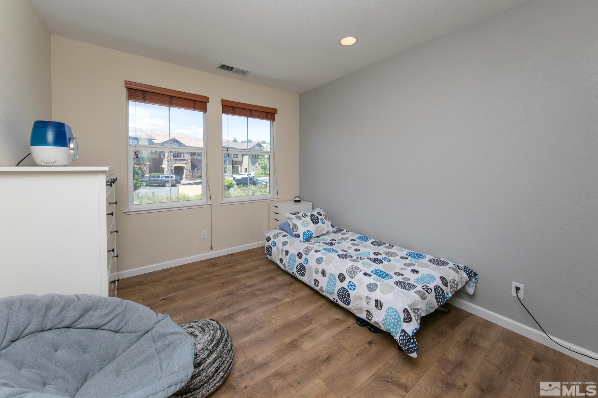 7665 Pebblestone Way Reno, NV 89523 - Photo 20 of 34 a bedroom with a bed and a window
