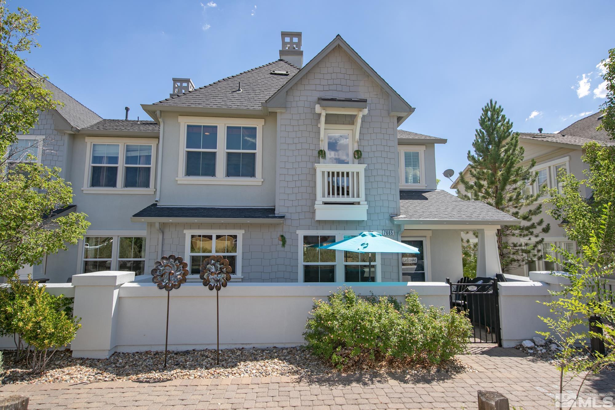 7665 Pebblestone Way Reno, NV 89523 - Photo 2 of 34 a front view of a house with garden