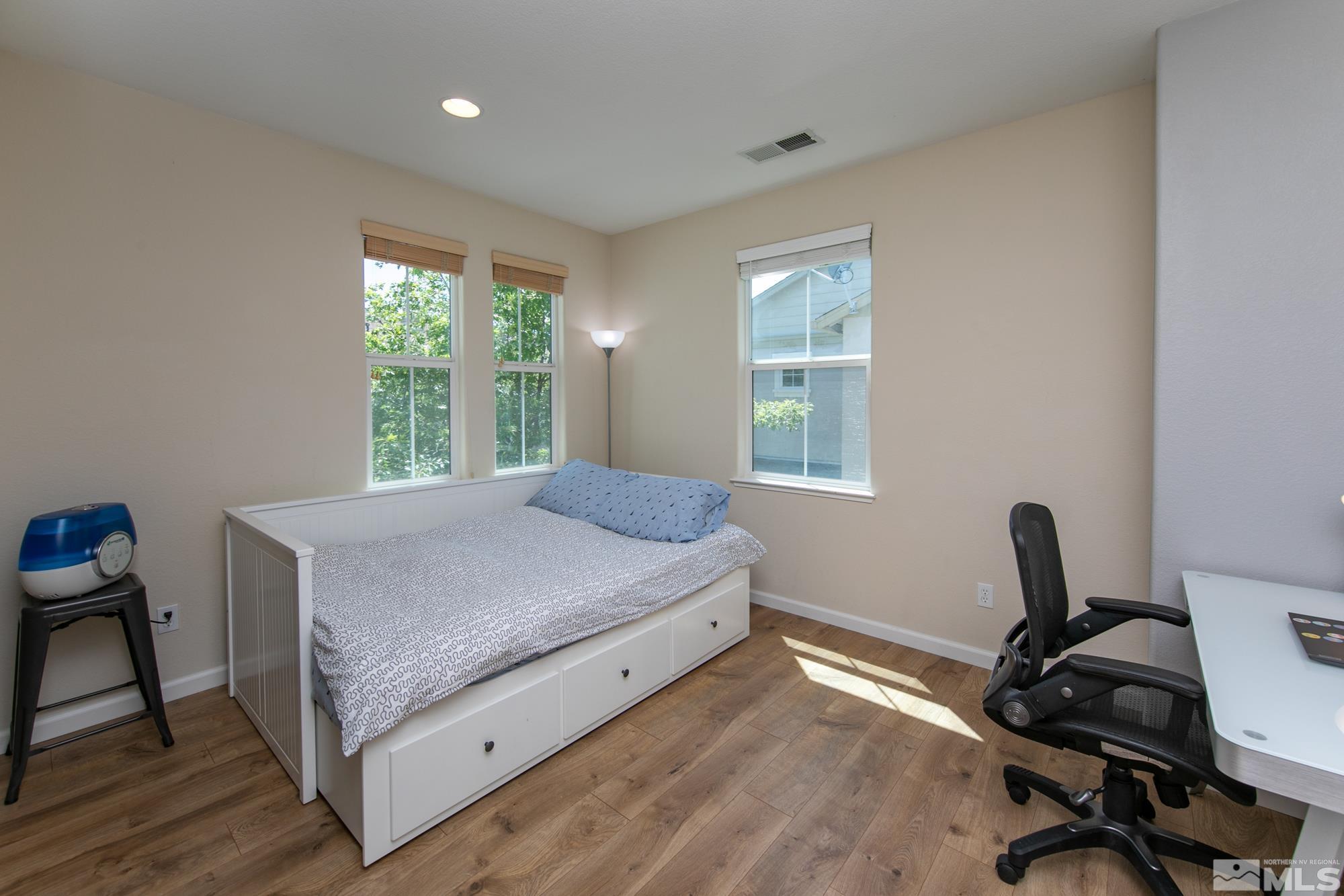 7665 Pebblestone Way Reno, NV 89523 - Photo 21 of 34 a bedroom with a bed and a desk