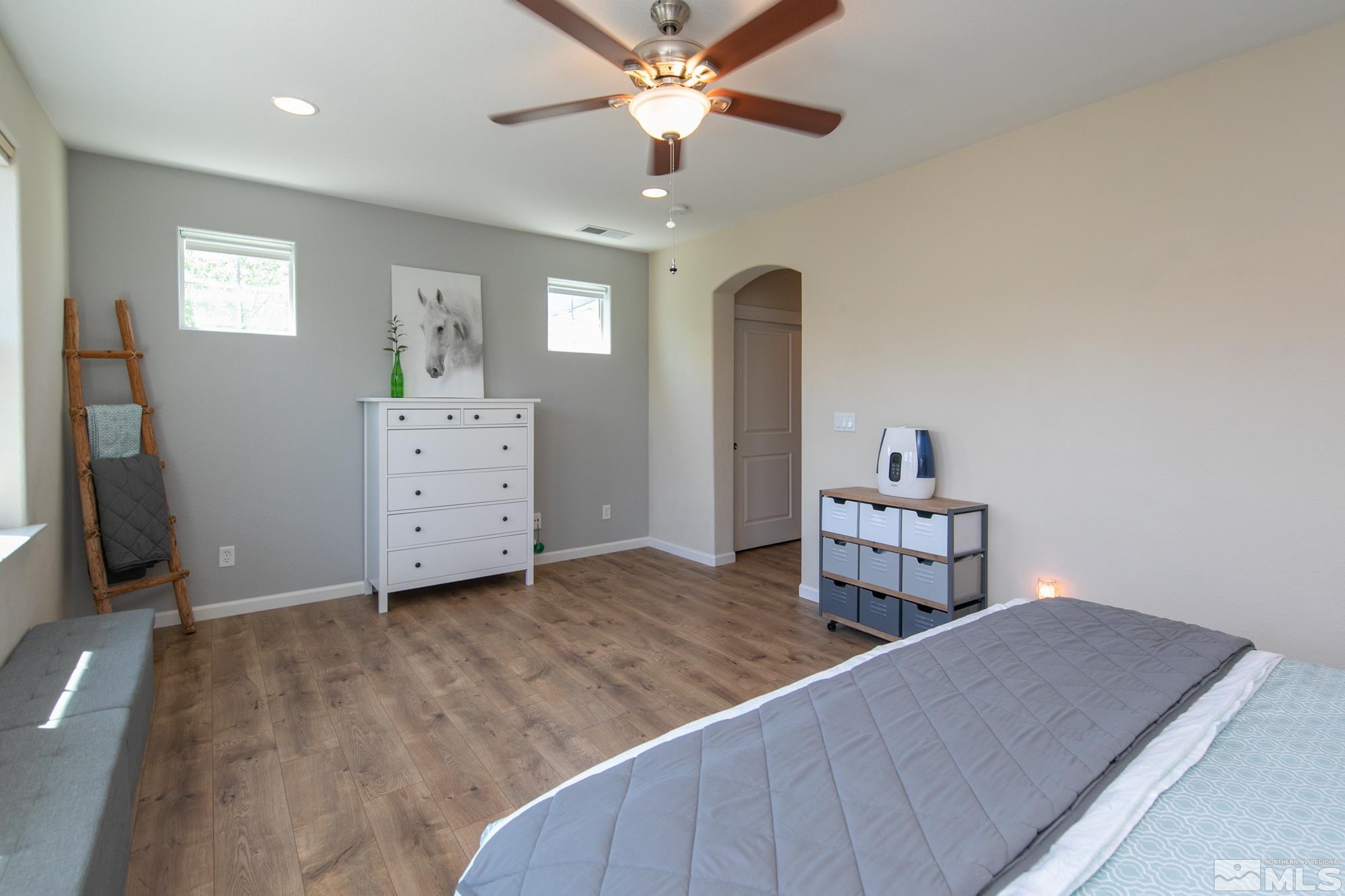 7665 Pebblestone Way Reno, NV 89523 - Photo 25 of 34 a bedroom with furniture and window
