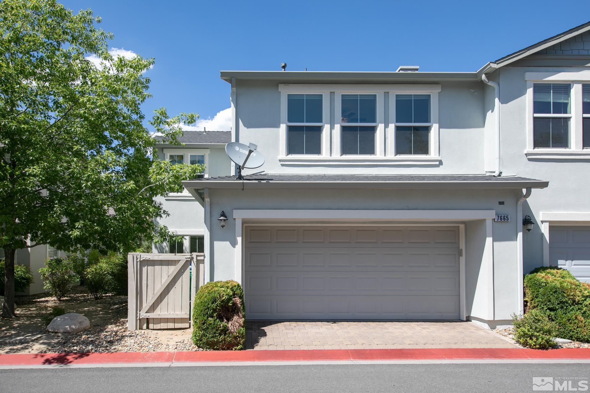 7665 Pebblestone Way Reno, NV 89523 - Photo 28 of 34 a front view of a house with garage