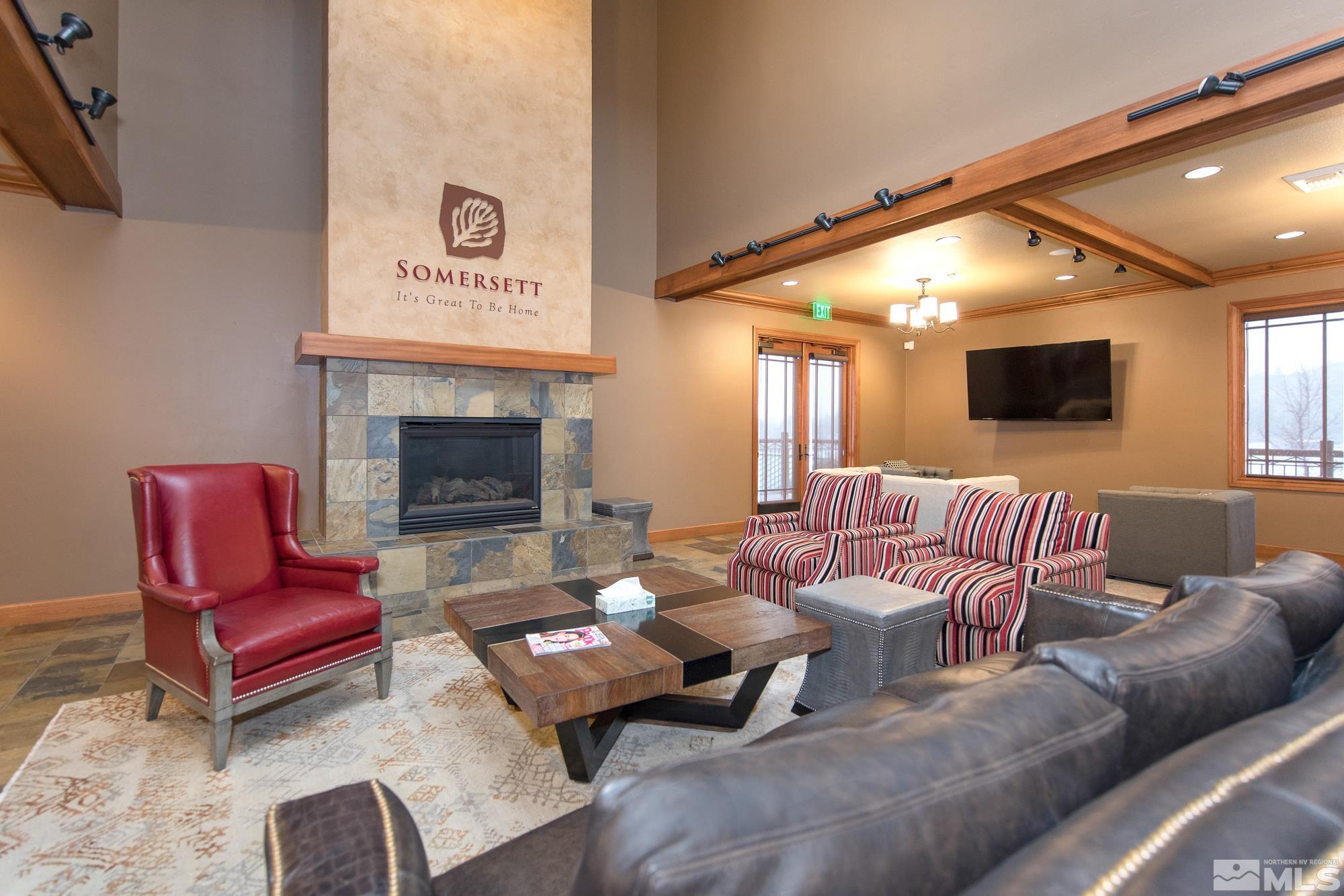 7665 Pebblestone Way Reno, NV 89523 - Photo 31 of 34 a living room with furniture and a fireplace