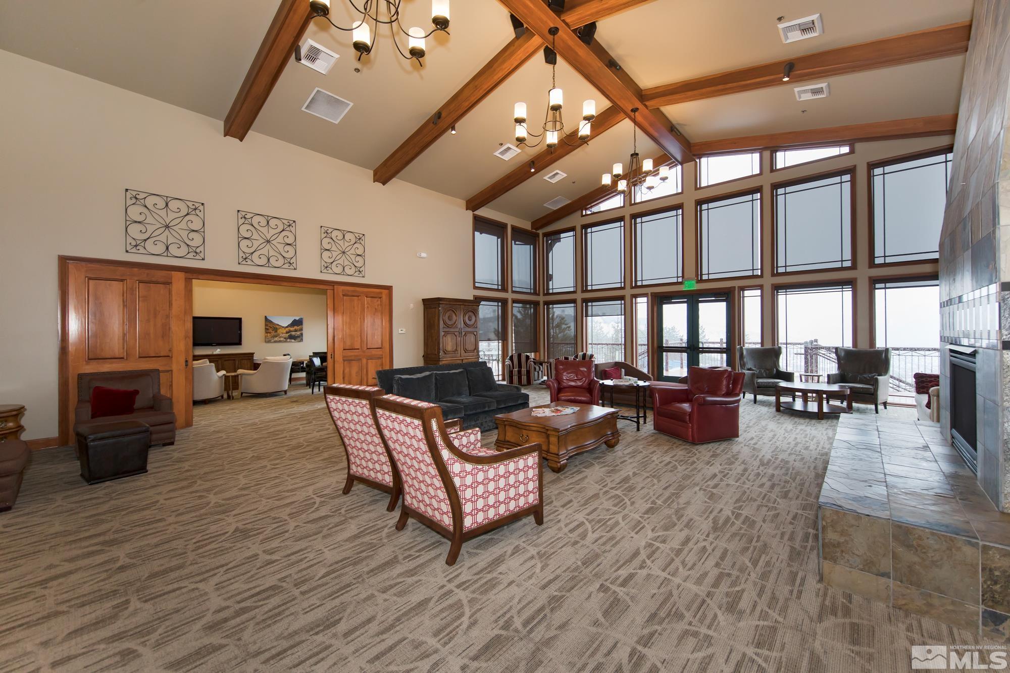 7665 Pebblestone Way Reno, NV 89523 - Photo 32 of 34 a living room with furniture and a fireplace