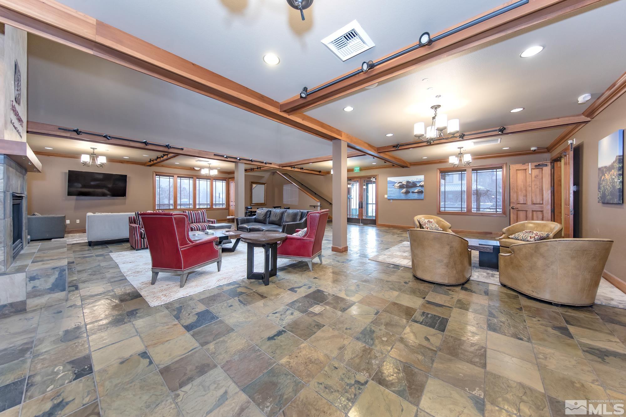 7665 Pebblestone Way Reno, NV 89523 - Photo 33 of 34 a living room with furniture and a flat screen tv