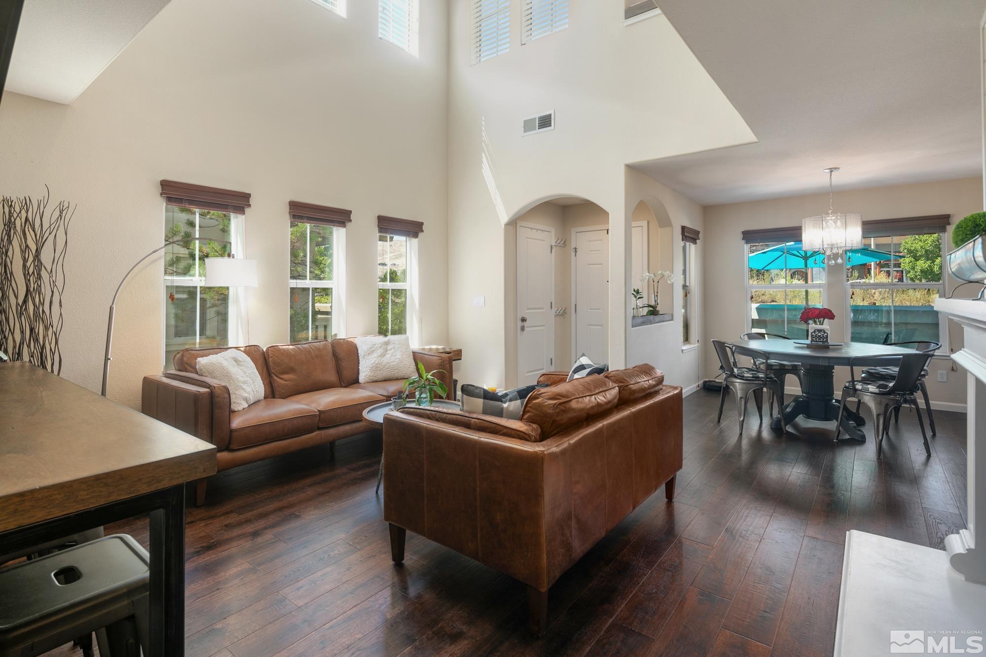7665 Pebblestone Way Reno, NV 89523 - Photo 4 of 34 a living room with furniture kitchen and a table