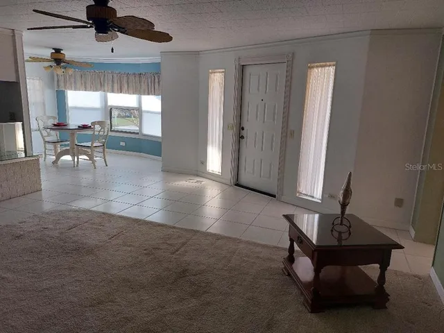 a view of a two chair and tables in the balcony