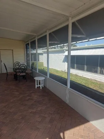 a large bedroom with a bed and a dresser