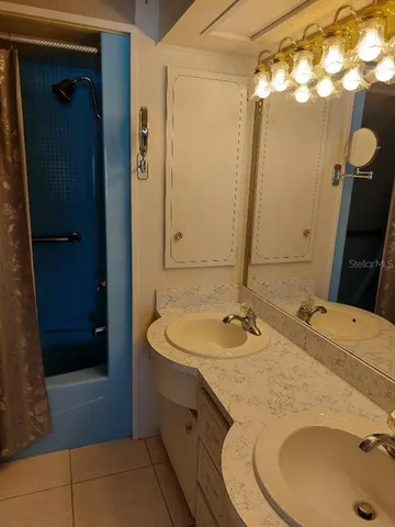 a bathroom with a sink and a mirror