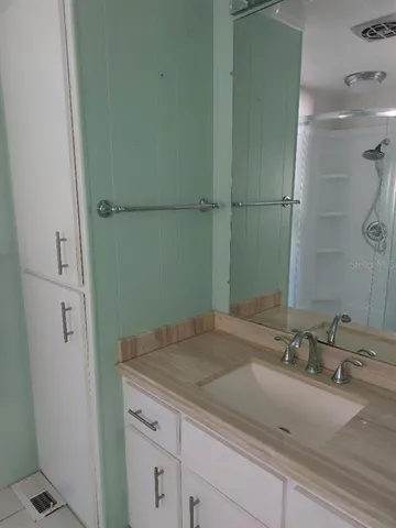 a bathroom with a shower and toilet