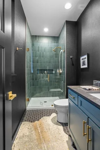 a living room with furniture and a bathroom