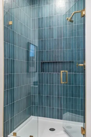 a bedroom with a bed and a mirror