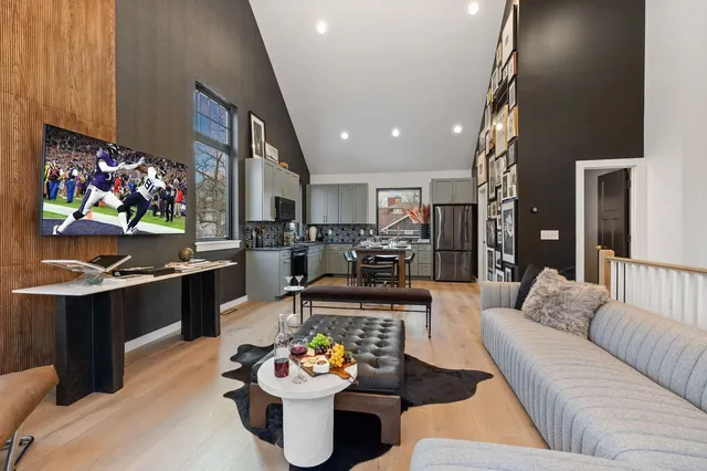 a bedroom with a bed and a painting on the wall