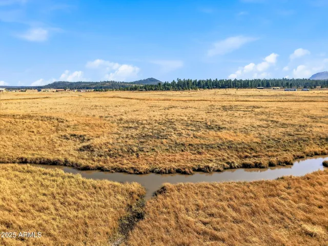 a view of an ocean and a mountain