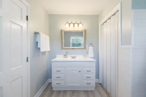 a room with a table and a refrigerator
