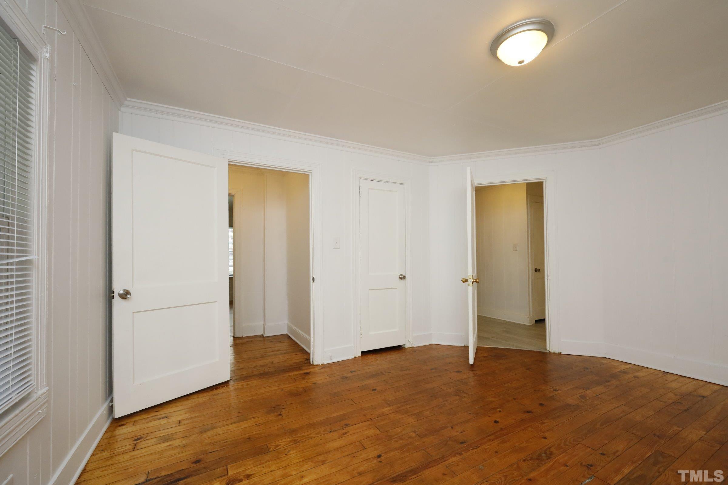 2522 Rochelle Street Durham, NC 27703 - Photo 20 of 28 a view of an empty room and wooden floor