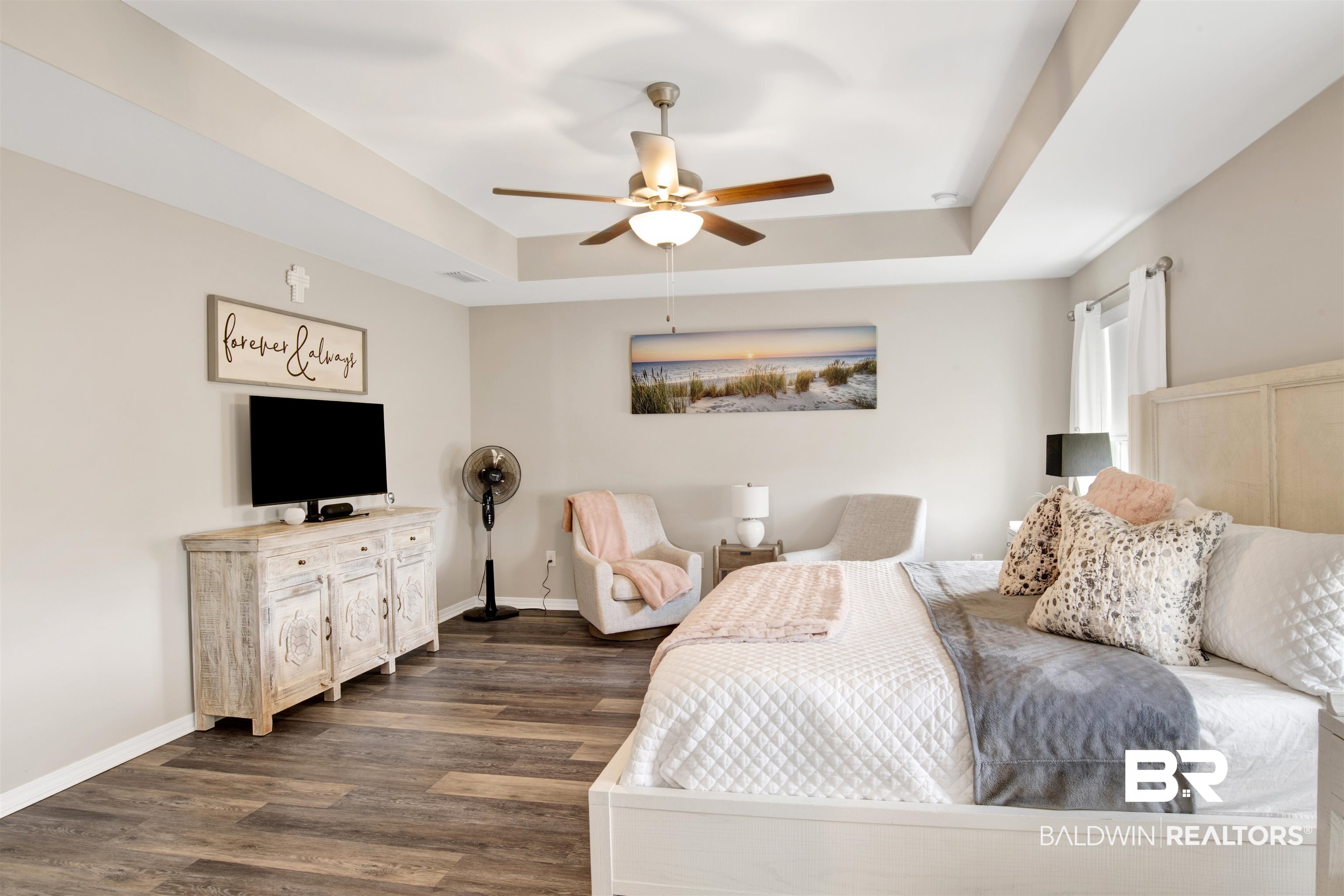 3097 Ingrid Lane Foley, AL 36535 - Photo 19 of 38 Bedroom featuring ceiling fan, a tray ceiling, and dark hardwood / wood-style flooring