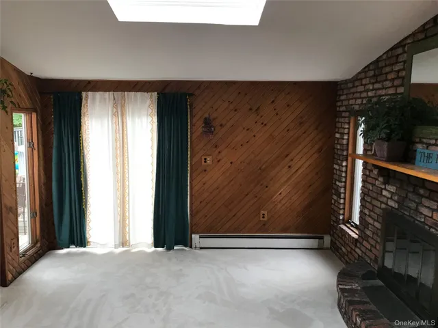 wooden floor and window in an empty room