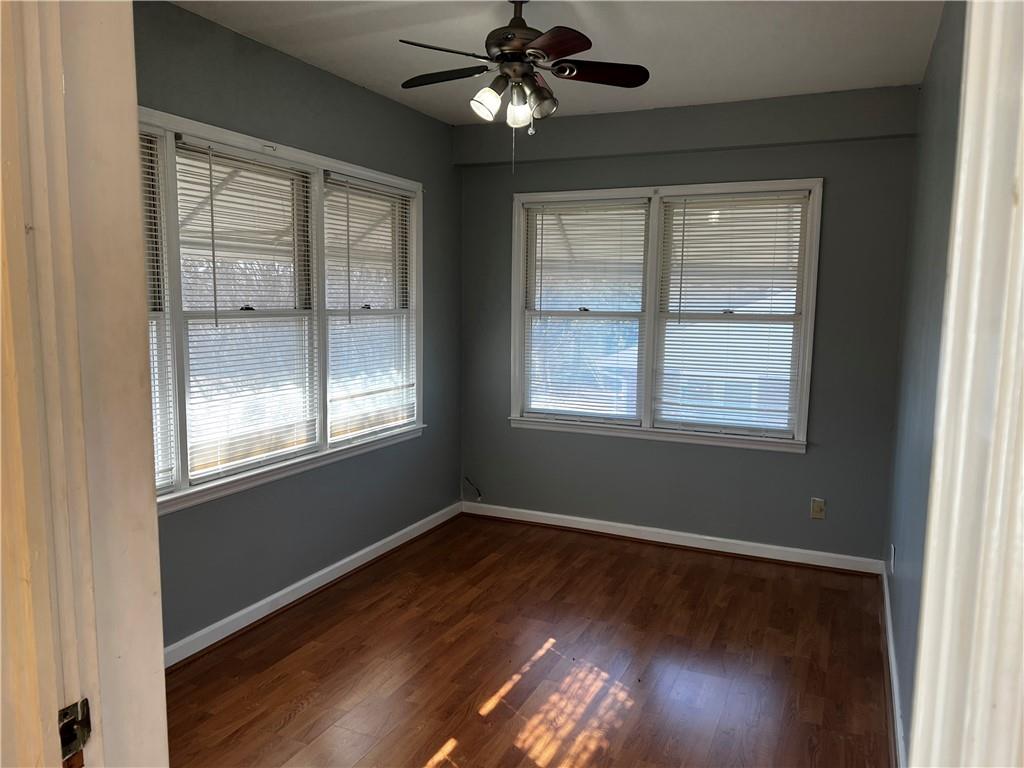 606 Pisgah Way Calhoun, GA 30701 - Photo 8 of 18 a view of an empty room with wooden floor and a window
